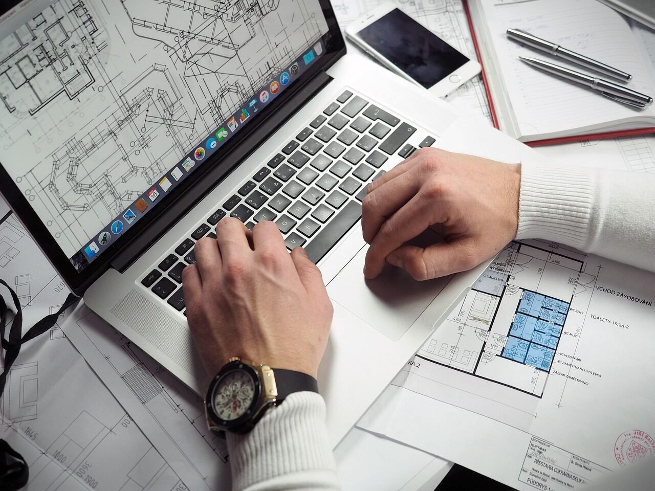 Professional reviewing a value-based spending plan on a laptop