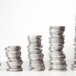 stacked coins image - Automated personal finance system