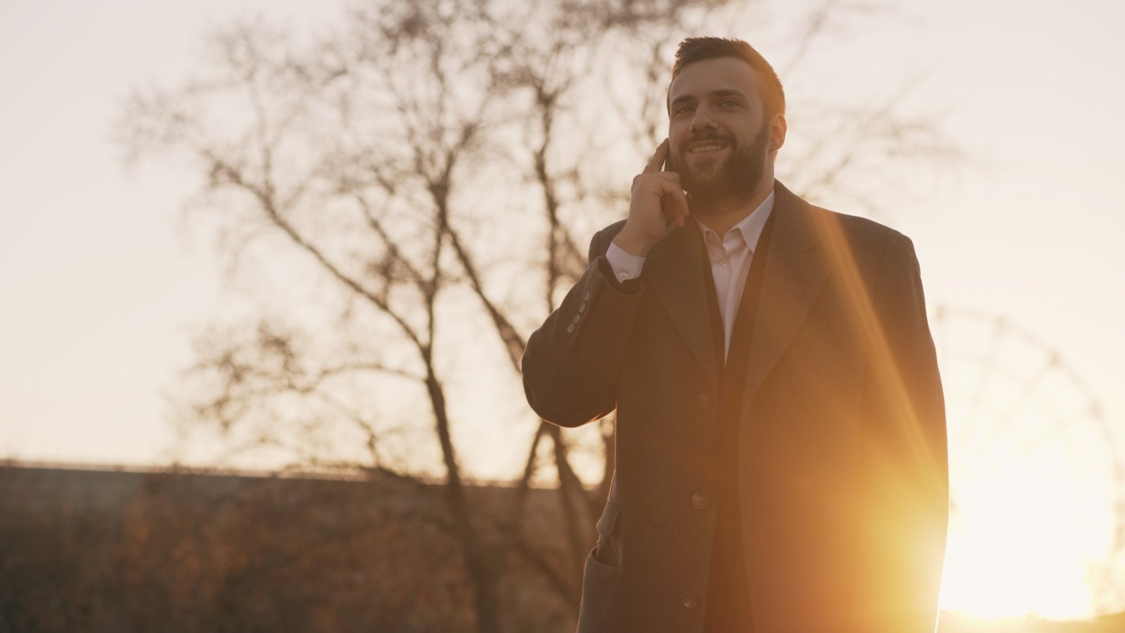 A busy professional taking a short walk during the workday to lower stress hormones and maintain physical health.
